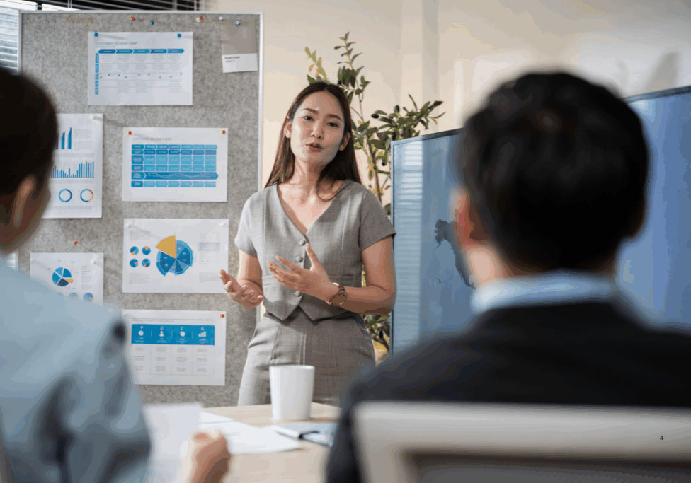 A business leader leading a team meeting focused on rebuilding leadership systems and preventing manager burnout.